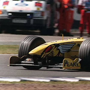 Damon Hill at the British Grand Prix July 1999 waves to the crowd at the end of the race