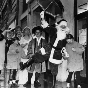 A damp start for Father Christmas as he arrives at Lewiss store in Liverpool