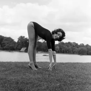 Dancer Gillian Lynne has her own idea of a sitting position whilst taking the sun Dancer Gillian Lynne has her own idea of a sitting position whilst taking the sun