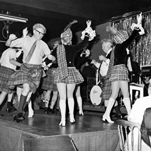 Dancing girls in mini-kilts and sporrans performing at the Caledonian Suite night club