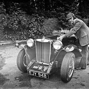 Dave Harris, 32, and his 1947 MG TC which he will be driving to Le Mans to see the famous