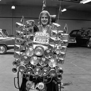 Dave Lewis(17), of Coventry sits on his very distinctive scooter which has 12 headlamps