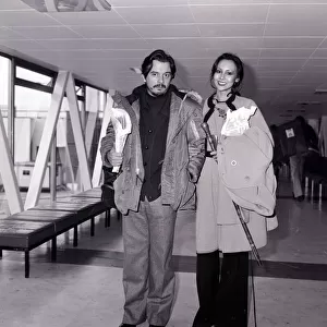 David Bailey, Photographer with his wife, Marie Helvin, Model at Heathrow airport