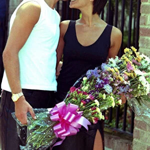 David Beckham kissing Victoria Adams July 1999 on the nose outside their