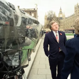 David Dimbleby, journalist and television presenter pictured during some outdoor filming