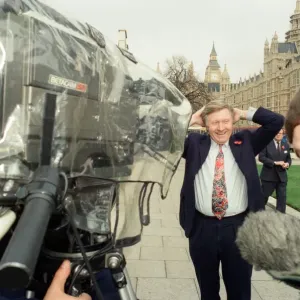 David Dimbleby, journalist and television presenter pictured during some outdoor filming
