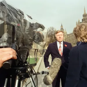 David Dimbleby, journalist and television presenter pictured during some outdoor filming