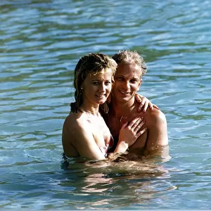 David Gower cricketer with Thorrun Nash in the sea during their visit to the West Indies