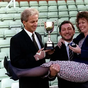 David Gower former England Cricket Captain holds cup presented to Trevor Clifford