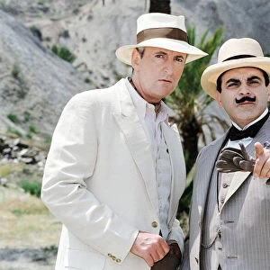 David Suchet as the famous Belgian detective Hercules Poirot (right