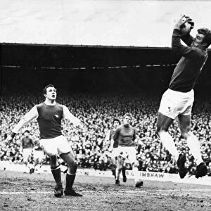 Davies, the Cardiff City goalkeeper gathers the ball as Arsenal