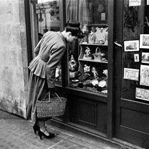 Day in the Life of Shepherds Market circa 1948 Local resident window shopping at No 13