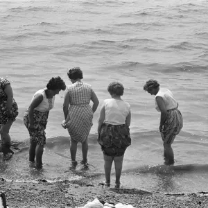 Day-trippers from Londons East End seen here paddling in the sea at Southend Day-trippers from Londons East End seen here paddling in the sea at Southend