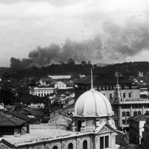 Last days of Singapore. A picture showing smoke rising over Singapore during a Japanese