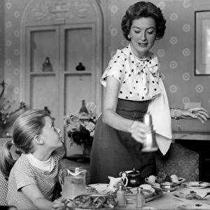 Deborah Kerr giving her daughters lunch in their hotel in London - June 1957