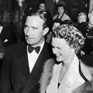 Denis Compton with partner arriving at the Variety show at london Palladium for Sid