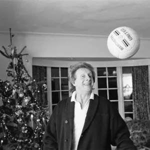 Denis Law, at home over Christmas in 1987. Denis Law CBE Denis Law, at home over Christmas in 1987. Denis Law CBE