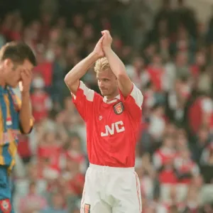 Dennis Bergkamp celebrates and applauds the fans for their support for his teams victory Dennis Bergkamp celebrates and applauds the fans for their support for his teams victory