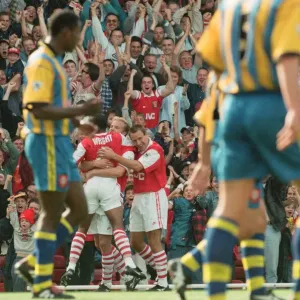 Dennis Bergkamp celebrates his first ever goal for his new club Arsenal Dennis Bergkamp celebrates his first ever goal for his new club Arsenal