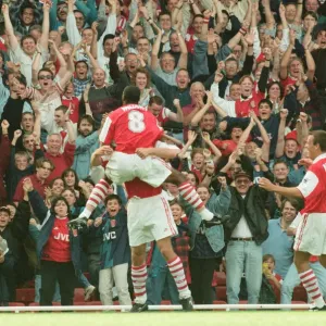 Dennis Bergkamp celebrates his first ever goal for his new club Arsenal Dennis Bergkamp celebrates his first ever goal for his new club Arsenal