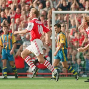 Dennis Bergkamp celebrates his second goal for his new club Arsenal Dennis Bergkamp celebrates his second goal for his new club Arsenal