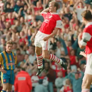 Dennis Bergkamp celebrates his second goal for his new club Arsenal Dennis Bergkamp celebrates his second goal for his new club Arsenal