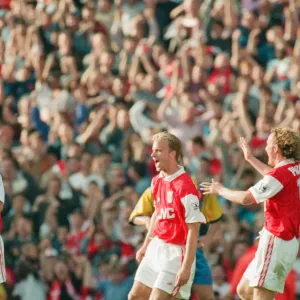 Dennis Bergkamp celebrates his second goal for his new club Arsenal Dennis Bergkamp celebrates his second goal for his new club Arsenal
