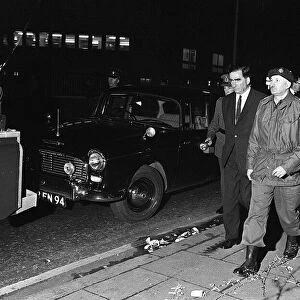 Dennis Healey is escorted down the Falls Road Belfast on a visit 1969