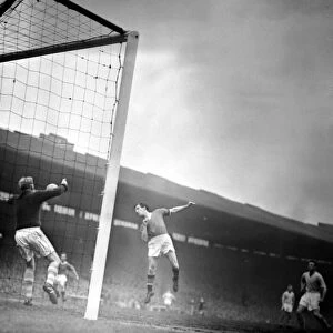 Dennis Viollet of Manchester United heads towards goal the Manchester City goal but