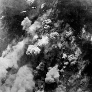 Dense smoke rising from the hail of bursting bombs as Avro Lancaster bombers of RAF Dense smoke rising from the hail of bursting bombs as Avro Lancaster bombers of RAF