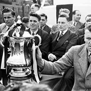 The Derby County team return home with the FA Cup trophy following their victory over