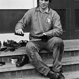 Derby County in training. Henry Newton of Derby County FC cleans his shoes during