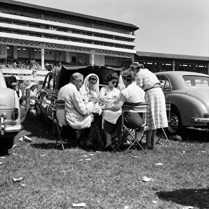 Derby Day at Epsom. Pictured, a family enjoy lunch. 3rd June 1959