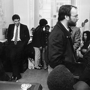 Derek Hatton looks on as he is imprisoned in his council office by members of the Black