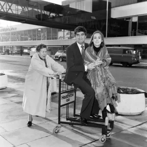 Derek Nimmo with Peggy Mount (left) and Paula Wilcox leaving Heathrow Airport for