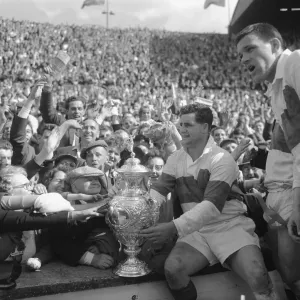 Derek Turner of Wakefield Trinity shows the trophy to fans after their 25 - 10 victory Derek Turner of Wakefield Trinity shows the trophy to fans after their 25 - 10 victory
