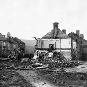 Derelict housing in an area of Stanley - workmen clear the site Derelict housing in an area of Stanley - workmen clear the site