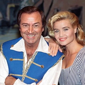 Des O Connor as Buttons and Jodie Wilson as Cinderella appearing in Cinderella at