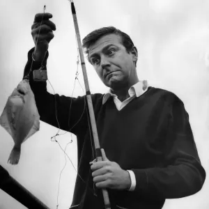 Des O Connor fishing off Blackpools North Pier. August 1966