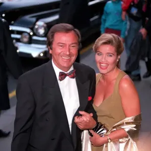 Print of Des O'Connor and Jaye Ryder arriving at Sunset Boulevard premiere