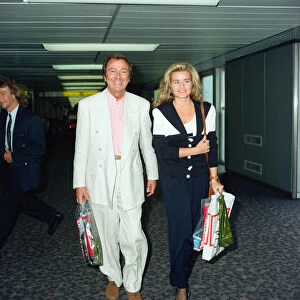 Des O Connor and girlfriend Jodie Brooke Wilson and Heathrow Airport