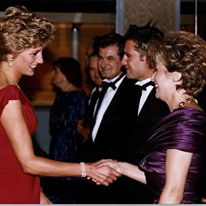 Diana, Princess of Wales shakes hands with actress Julie Walters as she attends