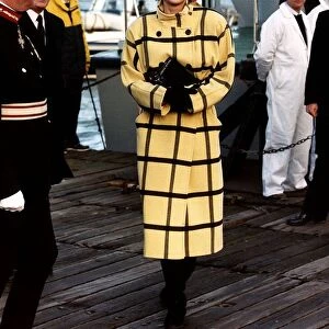 Diana, Princess of Wales, wearing a yellow and black woollen coat in blanket checks