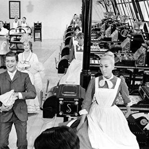 Dick Van Dyke and Sally Ann Howes (behind) filming a scene for Chitty Chitty Bang Bang
