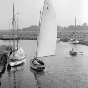 A dinghy sailing on the Norfolk Broads, circa 1936 A dinghy sailing on the Norfolk Broads, circa 1936