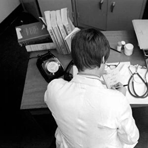 Doctors: The ever busy desk of an overworked doctor, often interrupted by telephone calls