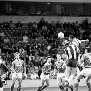 Don Goodman of West Bromwich Albion rises above everyone to flick on a header during