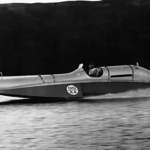 Donald Campbell at the wheel of Bluebird at a speed of 90mph on enestan water Donald Campbell at the wheel of Bluebird at a speed of 90mph on enestan water