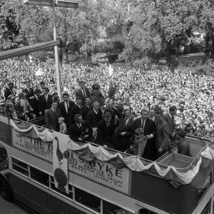A double decker bus carries the team holding the European Cup Winners Cup Winners trophy