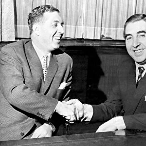 Doug Ellis (left), new Aston Villa Chairman, pictured shaking hands with financier Pat